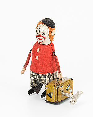 Schuler Auktionen AG - Schuco-Tanzfigur "Clown als Kofferträger"
