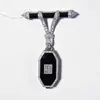 Schuler Auktionen AG - Email-Onyx-Diamant-Anhängeuhr mit Brosche