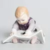 Schuler Auktionen AG - Meissen, Figur "Kind mit Bilderbuch, gross"