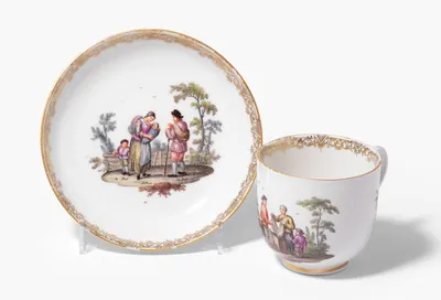Schuler Auktionen AG - Meissen, Tasse und Untertasse mit Teniers-Szenen