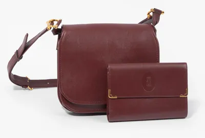 Schuler Auktionen AG - Cartier, Schultertasche und Portemonnaie "Must de Cartier"