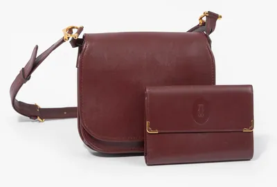 Schuler Auktionen AG - Cartier, Schultertasche und Portemonnaie "Must de Cartier"