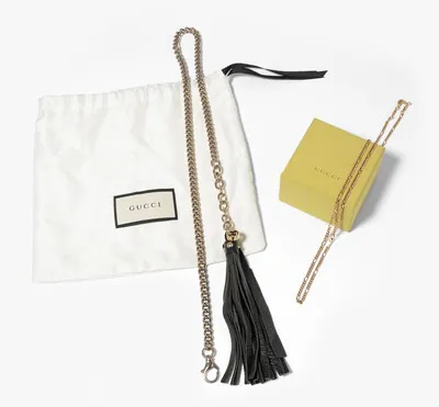 Schuler Auktionen AG - Gucci, Kettengürtel und Brillenkette
