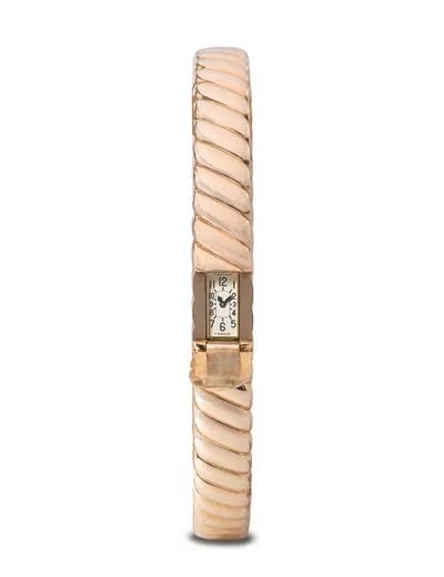 Schuler Auktionen AG - Cartier Armreif mit integrierter Uhr, Frankreich, um 1945